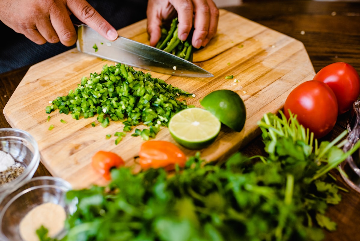 Colorful vegetable prep bowls with fresh greens and root vegetables